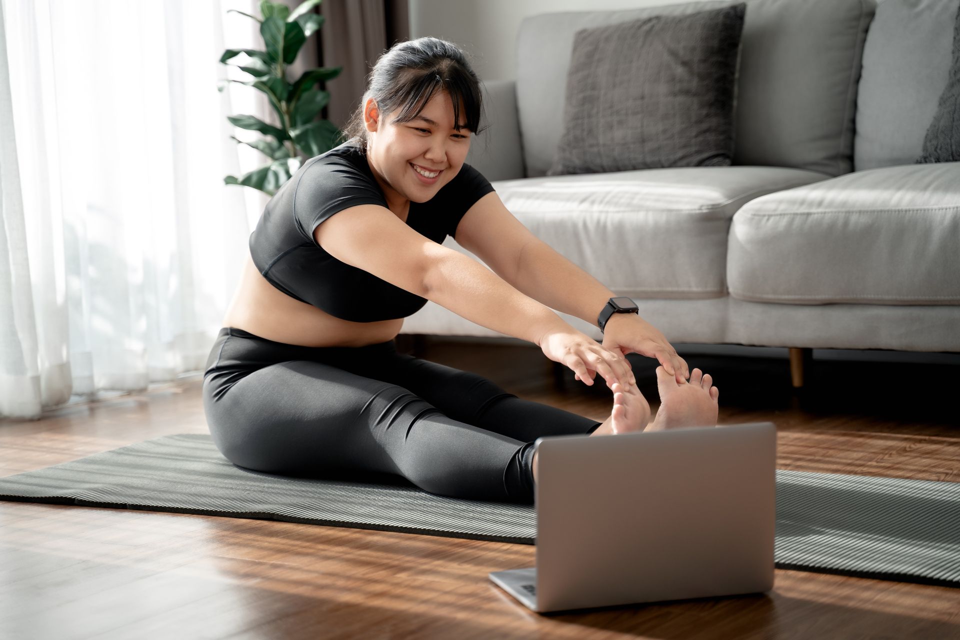 Woman doing Paschimotanasana